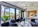 Bright sunroom boasts waterfront views, comfortable seating, and access to a bedroom, creating a relaxing retreat at 1235 Dockside Place # 108, Sarasota, FL 34242