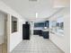Open and airy kitchen featuring blue cabinets and stainless steel appliances at 13241 Miami St, Hudson, FL 34667