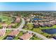 Aerial view showcases the community's homes, golf course, ponds, and the extensive landscaping at 135 Sweet Tree St, Bradenton, FL 34212