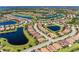 Beautiful aerial view of a community with stunning ponds and a meticulously maintained golf course at 135 Sweet Tree St, Bradenton, FL 34212