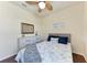 Comfortable bedroom features laminate floors, ceiling fan, and dresser at 135 Sweet Tree St, Bradenton, FL 34212