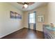 Cozy bedroom features a ceiling fan, natural light and laminate floors at 135 Sweet Tree St, Bradenton, FL 34212