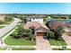 Lovely single-story home featuring a tile roof, brick driveway, and lush landscaping in a friendly neighborhood at 135 Sweet Tree St, Bradenton, FL 34212