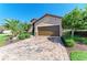 Charming single-Gathering home featuring a brick-paved driveway, lush landscaping, and an attached two-car garage at 135 Sweet Tree St, Bradenton, FL 34212