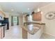 Well-equipped kitchen with granite countertops, stainless steel appliances, and ample cabinet space at 135 Sweet Tree St, Bradenton, FL 34212