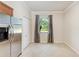 Bright kitchen nook with stainless steel refrigerator, pantry, and a window offering natural light at 135 Sweet Tree St, Bradenton, FL 34212