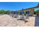 Patio dining area offering plenty of seating with blue umbrellas for shade, and exterior views at 135 Sweet Tree St, Bradenton, FL 34212