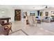 Bright, open floor plan with tile floors, comfortable seating, and elegant decor, perfect for entertaining guests at 142 Dory Ln, Osprey, FL 34229