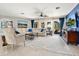Bright, open floor plan with tile floors, comfortable seating, and elegant decor, with great natural light at 142 Dory Ln, Osprey, FL 34229