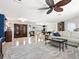 Spacious living room with elegant tile flooring, a ceiling fan, and an open layout with great natural light at 142 Dory Ln, Osprey, FL 34229