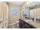 Updated bathroom featuring granite vanity and shower with tub at 1440 S Keene Rd, Clearwater, FL 33756