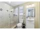 Bright bathroom with a glass-enclosed tiled shower and a white vanity at 1440 S Keene Rd, Clearwater, FL 33756