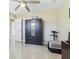 Bedroom features neutral walls, fan and tile floors at 1440 S Keene Rd, Clearwater, FL 33756