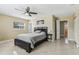 Bedroom with large bed, windows for natural light, and ceiling fan at 1440 S Keene Rd, Clearwater, FL 33756