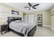 Bedroom featuring a large bed, fan, and closet space at 1440 S Keene Rd, Clearwater, FL 33756