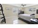 Bedroom with large bed, windows for natural light, and ceiling fan at 1440 S Keene Rd, Clearwater, FL 33756