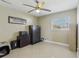 Bedroom with neutral walls, fan and plenty of natural light from window at 1440 S Keene Rd, Clearwater, FL 33756