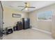 Bedroom with neutral walls, fan and plenty of natural light from window at 1440 S Keene Rd, Clearwater, FL 33756