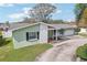 Charming single-story home featuring a brick accent, well-maintained lawn, and inviting curb appeal at 1440 S Keene Rd, Clearwater, FL 33756