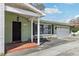 Charming one-story home with a cozy porch and well-manicured front yard at 1440 S Keene Rd, Clearwater, FL 33756