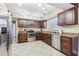 Updated kitchen featuring granite countertops, stainless steel appliances, and lots of cabinet space at 1440 S Keene Rd, Clearwater, FL 33756