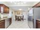 Bright eat-in kitchen features stainless appliances and access to back entry at 1440 S Keene Rd, Clearwater, FL 33756