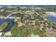 Aerial view of community featuring mature trees and a beautiful lake with lush green landscape at 1533 42Nd Avenue E Dr # 48, Ellenton, FL 34222