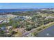 Expansive aerial view showcases a tranquil community, lush green spaces, and scenic waterfront views at 1533 42Nd Avenue E Dr # 48, Ellenton, FL 34222