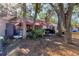 Backyard view featuring a patio, outdoor seating and mature shade trees at 1533 42Nd Avenue E Dr # 48, Ellenton, FL 34222