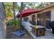 The backyard features a shaded patio with a gas grill and outdoor seating at 1533 42Nd Avenue E Dr # 48, Ellenton, FL 34222