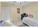 Comfortable bedroom with a ceiling fan, desk area, and ample closet space at 1533 42Nd Avenue E Dr # 48, Ellenton, FL 34222