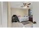 Cozy bedroom with a ceiling fan, desk, and natural light, perfect for a relaxing atmosphere at 1533 42Nd Avenue E Dr # 48, Ellenton, FL 34222