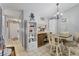 Dining area with a chandelier with a storage shelf, ideal for Gathering meals and entertaining at 1533 42Nd Avenue E Dr # 48, Ellenton, FL 34222