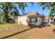Exterior of house with a view of the sunroom, grassy yard, and stone pathway at 1533 42Nd Avenue E Dr # 48, Ellenton, FL 34222