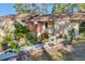Inviting home exterior features a well-manicured front yard with decorative plants and a charming walkway at 1533 42Nd Avenue E Dr # 48, Ellenton, FL 34222