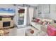 Living room with fireplace, neutral walls, tile flooring, and sliding door to patio at 1533 42Nd Avenue E Dr # 48, Ellenton, FL 34222