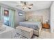 Comfortable main bedroom with a large bed, neutral décor, and a ceiling fan at 1533 42Nd Avenue E Dr # 48, Ellenton, FL 34222