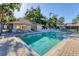 Community pool area features chairs and is enclosed by a chain link fence at 1533 42Nd Avenue E Dr # 48, Ellenton, FL 34222