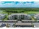 Stunning aerial view of the condo and community with well-manicured landscaping and parking at 18028 Gawthrop Dr # 203, Bradenton, FL 34211