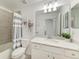Bathroom with a tub/shower combination and decorative mirror at 18028 Gawthrop Dr # 203, Bradenton, FL 34211