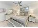 This bedroom boasts a ceiling fan, neutral colors and a complete bedroom set at 18028 Gawthrop Dr # 203, Bradenton, FL 34211