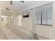 This bedroom has a television, ceiling fan and a window at 18028 Gawthrop Dr # 203, Bradenton, FL 34211