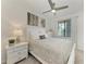 This bedroom has a ceiling fan, a picture window and a complete bedroom set at 18028 Gawthrop Dr # 203, Bradenton, FL 34211