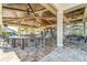 Open-air community bar with high ceilings, ceiling fans, and comfortable seating for socializing at 18028 Gawthrop Dr # 203, Bradenton, FL 34211