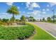 Inviting community entrance with mature trees, manicured landscaping and a beautiful fountain in Lakewood National at 18028 Gawthrop Dr # 203, Bradenton, FL 34211