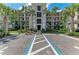 Condo exterior with well-manicured landscaping and accessible parking in view at 18028 Gawthrop Dr # 203, Bradenton, FL 34211