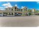 Exterior view of condo and covered parking with well-maintained landscaping at 18028 Gawthrop Dr # 203, Bradenton, FL 34211