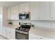 Kitchen showcases stainless steel appliances, quartz countertops and bright white cabinetry at 18028 Gawthrop Dr # 203, Bradenton, FL 34211