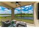 Patio with wicker chairs and beautiful lake views at 18028 Gawthrop Dr # 203, Bradenton, FL 34211