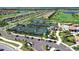 Aerial view of the community featuring tennis courts, houses, a golf course and ponds at 18028 Gawthrop Dr # 406, Bradenton, FL 34211